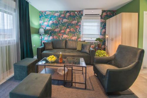 a living room with a couch and a table at Apartmani Darijana in Ljubovija