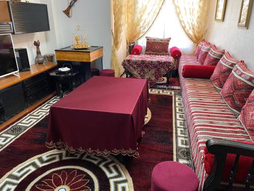 a living room with a couch and a table at CASA NOUR con parking in Elche