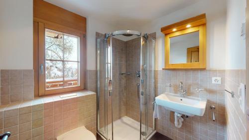 a bathroom with a shower and a sink and a toilet at Terrasses du Paradis 7A LUXE & CENTER apart 8 pers in Nendaz