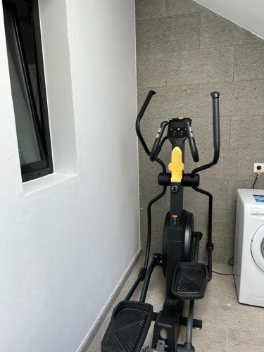 a scooter is parked in a room next to a wall at Apartamento Tierra y Mar 1 in Arrecife