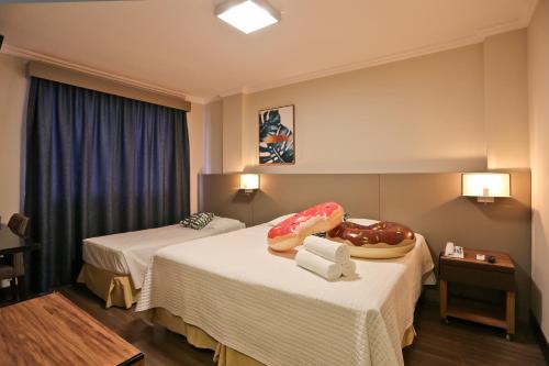 Katil atau katil-katil dalam bilik di Sandri City Hotel