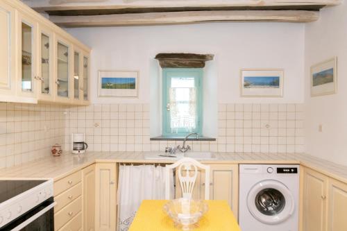 A kitchen or kitchenette at Galatea House Katoï with patio