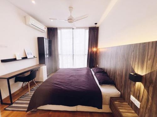a bedroom with a large bed and a desk at [PROMO]Connected train 2 Bedroom (ABOVE MALL)15 in Kuala Lumpur