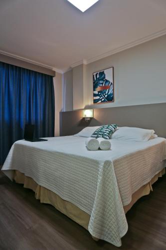 Katil atau katil-katil dalam bilik di Sandri City Hotel
