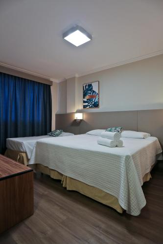 Katil atau katil-katil dalam bilik di Sandri City Hotel