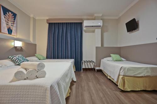 Katil atau katil-katil dalam bilik di Sandri City Hotel