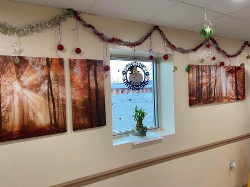 a window in a room with christmas decorations at Circle Motor Lodge in South Amboy