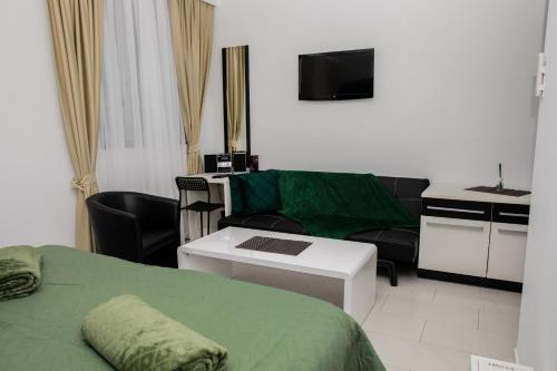 Una cama o camas en una habitación de Vladys Vienna Apartments