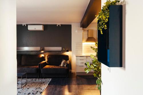 a living room with a couch and a table at TSA La Mare in Barcelona