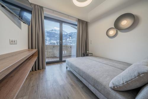 a bedroom with a bed and a large window at Miramonte in Sölden