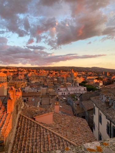 a view of a city at sunset at SanFa Roof in Viterbo