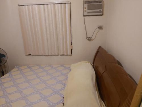 A bed or beds in a room at RoomForRent