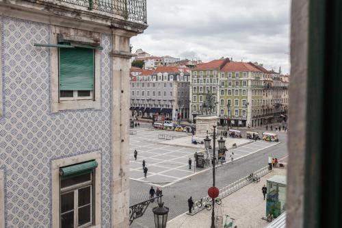 a view of a street in a city with buildings at FLH Praça Rossio Contemporary Flat in Lisbon