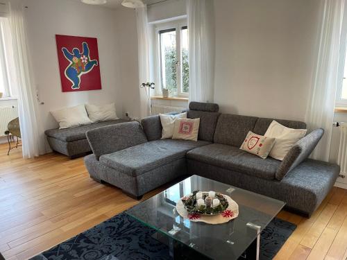 a living room with a couch and a table at Ferienwohnung Bett & Burg in Wertheim