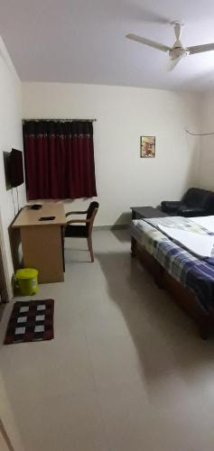 Postel nebo postele na pokoji v ubytování Brookside Service Apartment