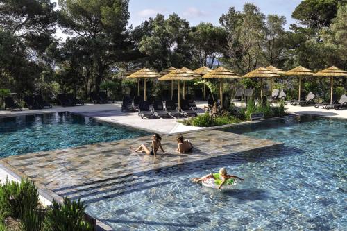 a group of people in the swimming pool at a resort at Belambra Clubs Presqu'île De Giens - les Criques in Hyères