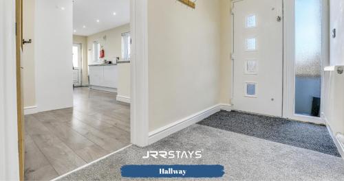 a hallway of a home with white walls and a kitchen at Cockermouth - 3 Bedroom, Sleeps 10 Garden - JRR Stays in Cockermouth