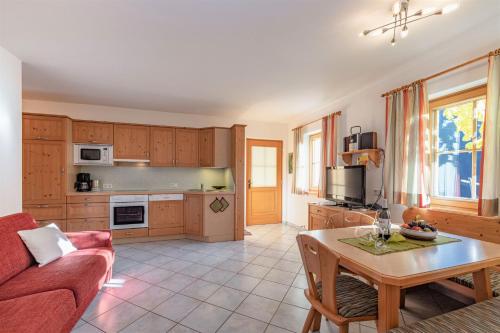 a living room with a couch and a table at Genusshof Mesner Aktiv in Liesing