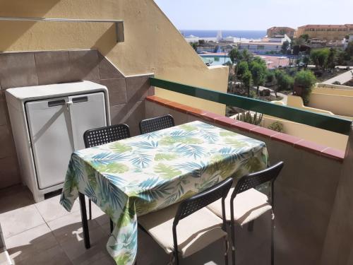 a table and chairs on a balcony with a view at Casa Barbara in Costa de Antigua
