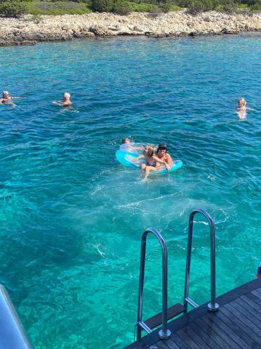 a group of people swimming in the water at Wohnhaus City Süd in Herzogsdorf