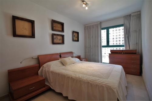 Postel nebo postele na pokoji v ubytování A802 - Atrium Beach 4