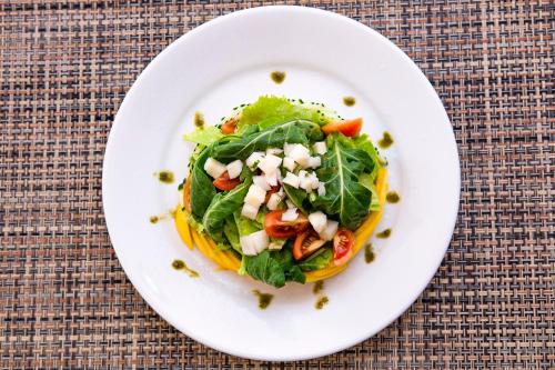 a plate of food with a salad on a table at Itu Garden - SPA e Resort Saudavel in Itu