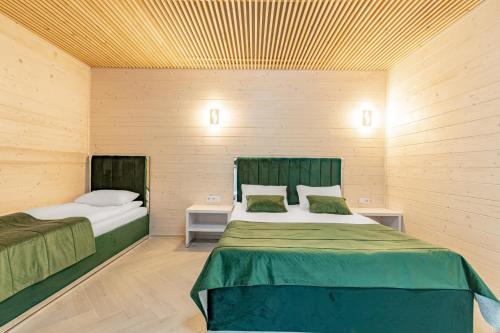 Una cama o camas en una habitación de Milana SPA & Hotel - SPA included