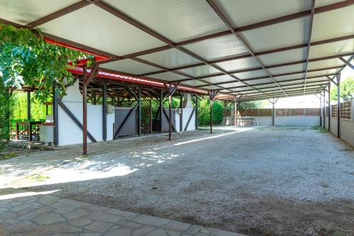an empty building with awning over a parking lot at Oniro Luxury Villas in Toroni