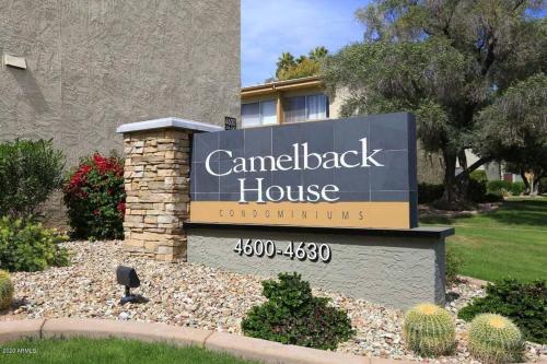 a sign for a canadianack house in front of a building at Entire 2 level townhouse in Old Town Scottsdale! in Scottsdale