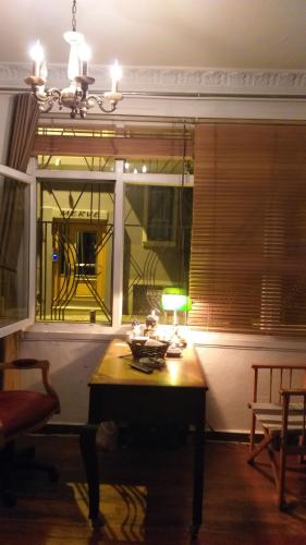 a room with a table and a window with a lamp at Private Room in Istanbul #20 in Istanbul