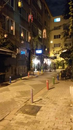 an empty city street at night with buildings at Private Room in Istanbul #20 in Istanbul