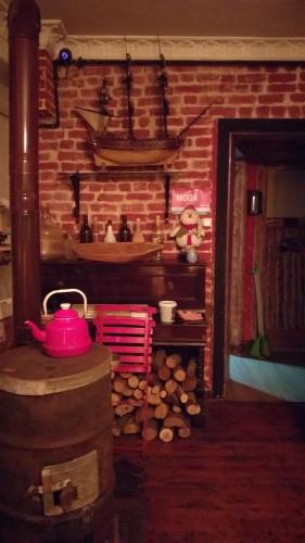 a kitchen with a brick wall and a red pot on a stove at Private Room in Istanbul #20 in Istanbul