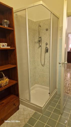 a shower with a glass enclosure in a bathroom at Come a casa in Tognazza