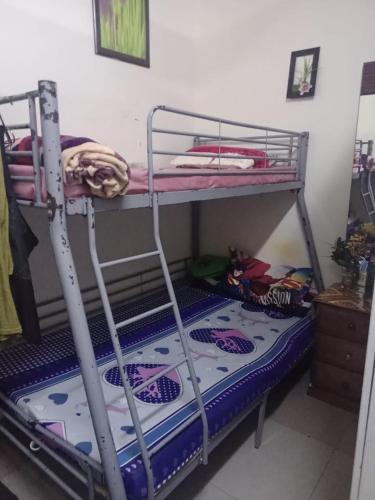 a bunk bed with a mattress on the bottom bunk at dormitory bed space for male and female in Sharjah
