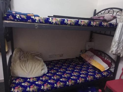 a bedroom with two bunk beds with a mattress at dormitory bed space for male and female in Sharjah
