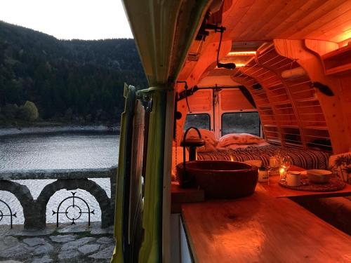 an outside view of an rv with a view of a lake at Dreamer in Munster