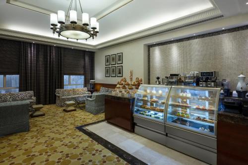 a lobby with a display case in a store at Swissotel Al Maqam Makkah in Makkah