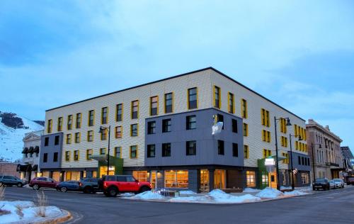 a building on a street with cars parked in front of it at The Wren in Missoula