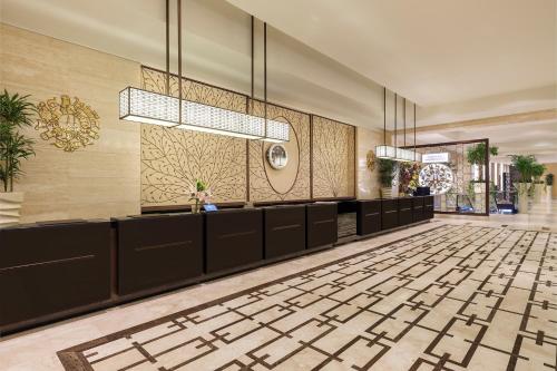 a lobby of a hotel with a tile floor at Swissotel Makkah in Makkah