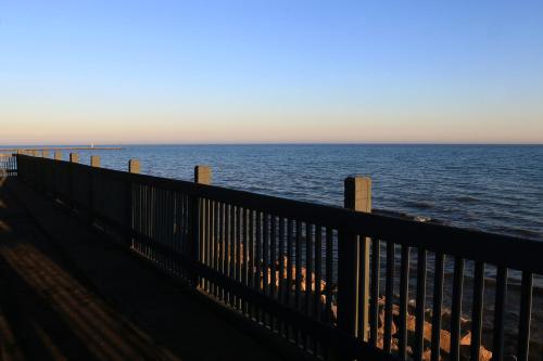 a view of the ocean from a pier at Lighthouse Inn - Two Rivers in Two Rivers