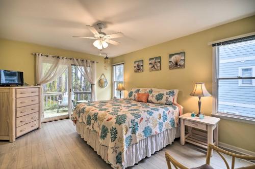 a bedroom with a bed and a ceiling fan at Coastal Home with Community Pool Less Than 2 Miles to Beach! in Corolla