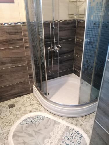 a shower with a glass door in a bathroom at Villa calış 2 in Fethiye