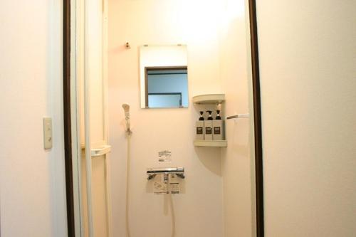 a bathroom with a phone on the wall next to a door at RETRO retro - Vacation STAY 03865v in Azagawa