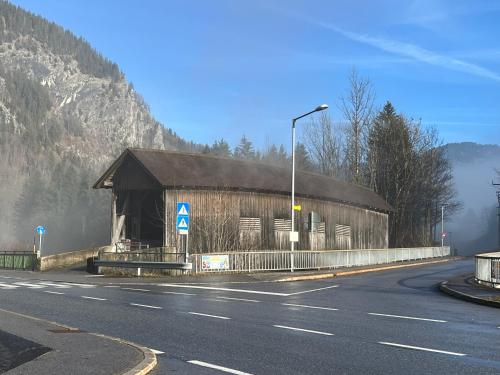 a building on the side of a road at Bergluft Apartment MELLAU in Mellau