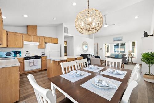 a kitchen and dining room with a table and chairs at Seas The Day in Seaside