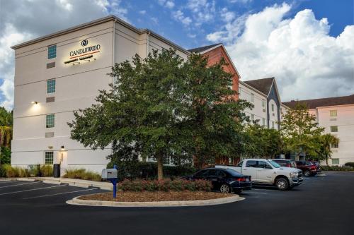a building with cars parked in a parking lot at Candlewood Suites - Bluffton-Hilton Head by IHG in Bluffton