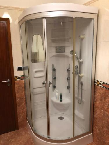 a shower stall with a sink in a bathroom at SMM Apartment in Ferrara