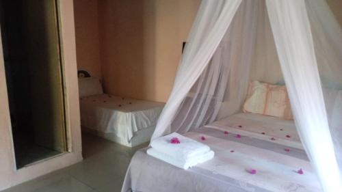 Un ou plusieurs lits dans un hébergement de l'établissement ECOHOTEL LAS FLORES Econativo