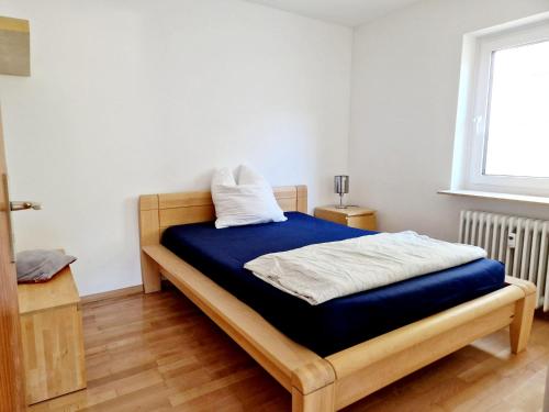 a bedroom with a bed with a blue mattress at Seestudio mit toller Aussicht am Bodensee in Bodman-Ludwigshafen