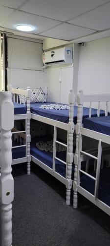a bedroom with two bunk beds in a room at Hostel Princess Copacabana in Rio de Janeiro